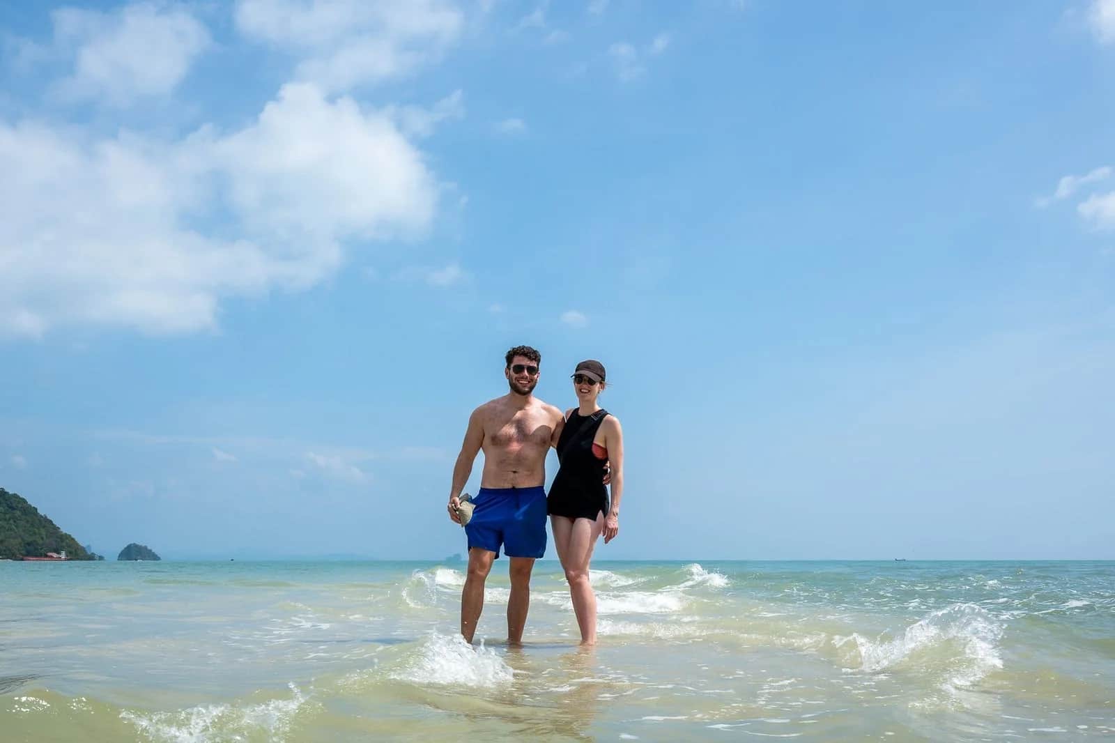 Guests walking a quiet sandbar in Phang Nga Bay at low tide
