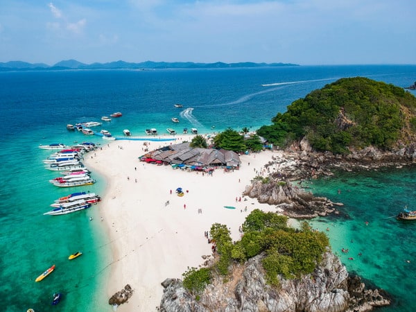 an aerial view of the phi phi islands as seen from a drone with boats anchored ashore